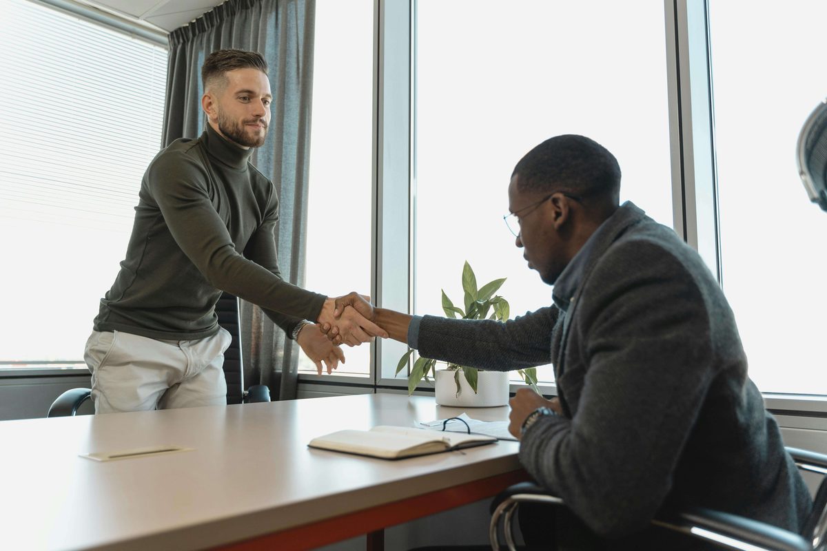 salary negotiation meeting office handshake