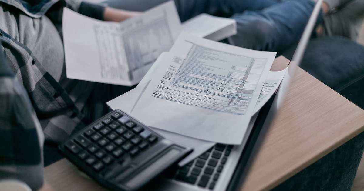 Tax forms and calculator representing National Insurance UK explained 2026