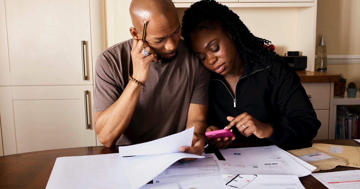 couple reviewing financial documents bills south africa budget 2026