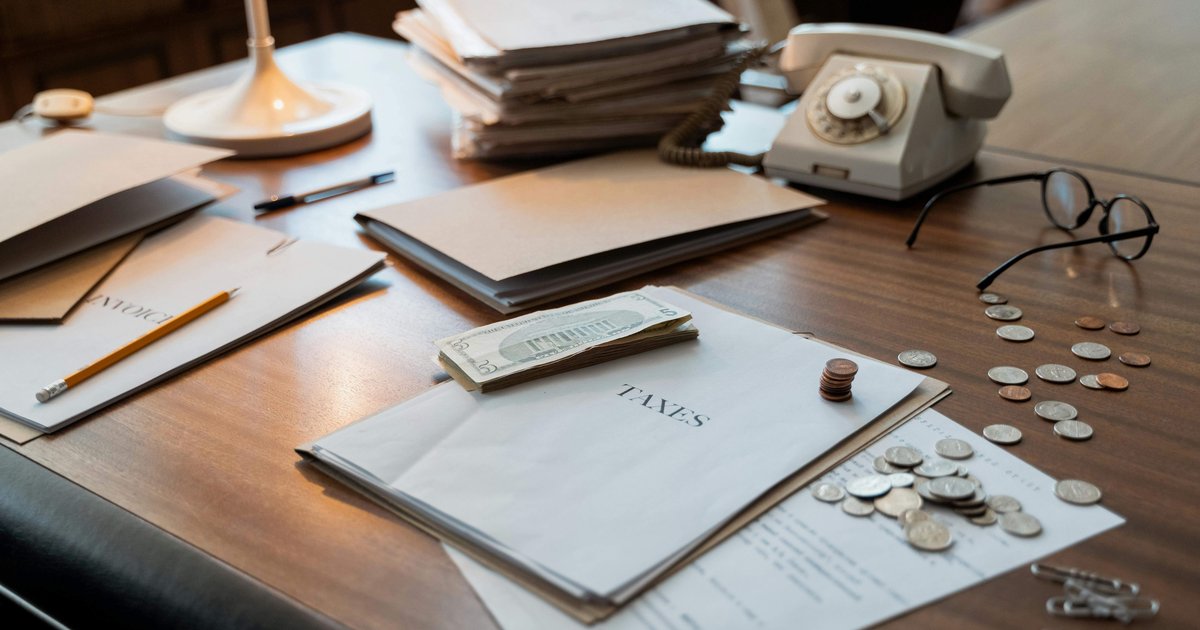 UIF South Africa 2026 tax documents and coins on desk